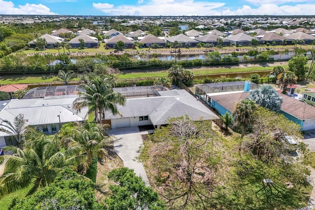 bird's eye view featuring a water view and a residential view