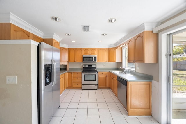 kitchen with light tile patterned floors, a sink, visible vents, light countertops, and appliances with stainless steel finishes