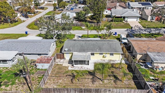 birds eye view of property with a residential view