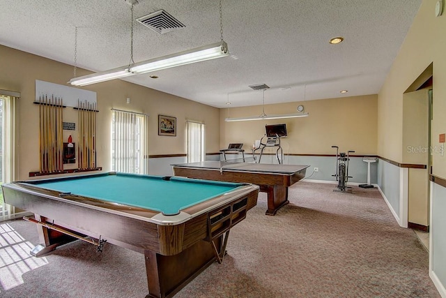 rec room featuring a textured ceiling, billiards, carpet flooring, and visible vents