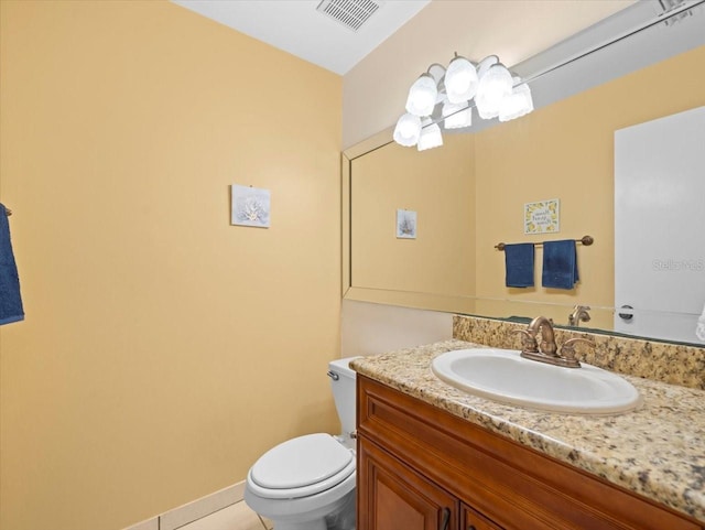 half bath featuring toilet, baseboards, visible vents, and vanity