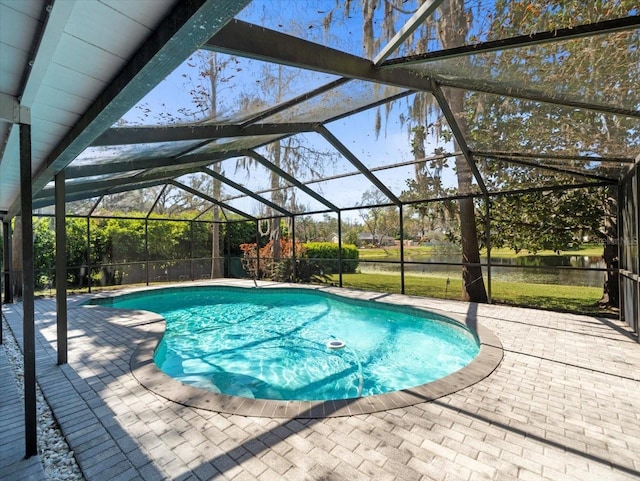 pool featuring a lanai and a patio area