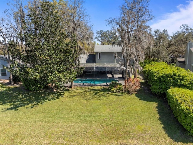 view of yard with an outdoor pool