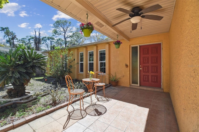 view of patio featuring a ceiling fan