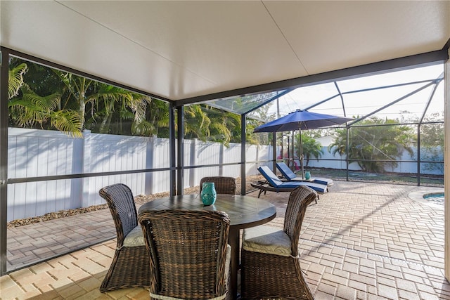 sunroom / solarium with outdoor dining area