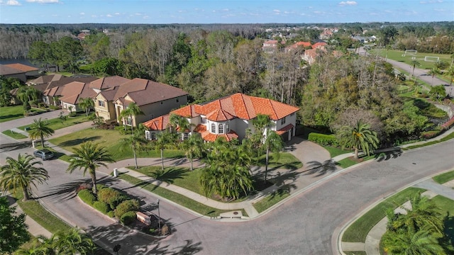 birds eye view of property with a forest view