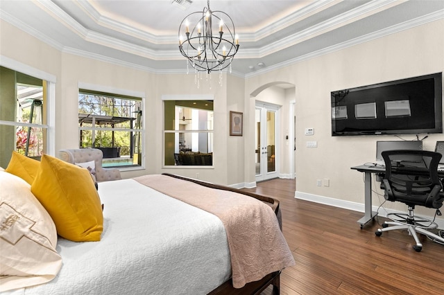 bedroom with baseboards, dark wood finished floors, an inviting chandelier, arched walkways, and a raised ceiling