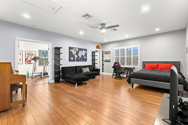 bedroom featuring recessed lighting, multiple windows, light wood-style floors, and visible vents