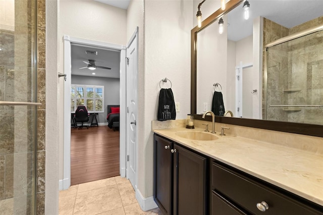 ensuite bathroom featuring tile patterned floors, visible vents, a stall shower, ensuite bathroom, and vanity