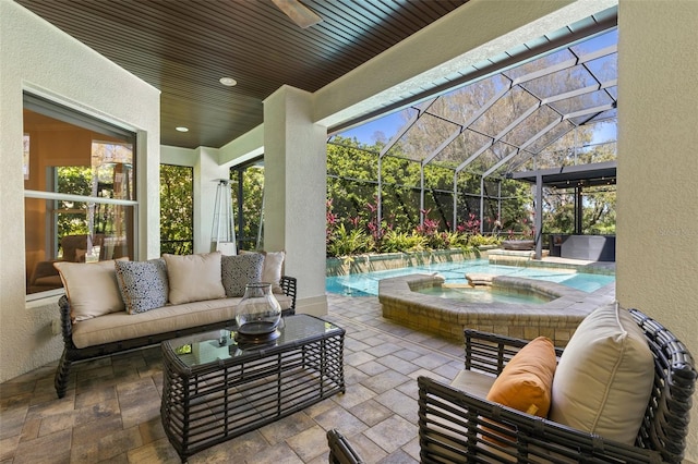 view of patio / terrace featuring a lanai, an outdoor pool, an in ground hot tub, and outdoor lounge area