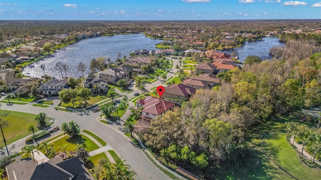 birds eye view of property with a residential view and a water view