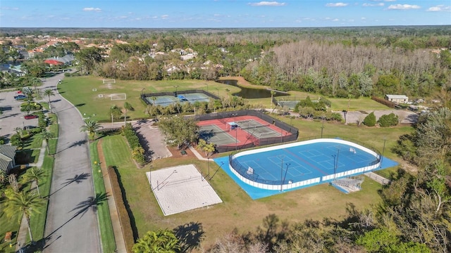 birds eye view of property with a wooded view