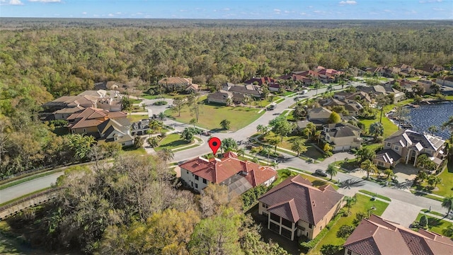 aerial view with a residential view and a wooded view