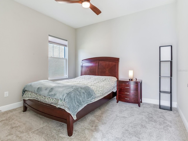 bedroom featuring a ceiling fan, carpet, and baseboards