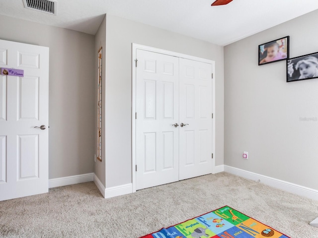 recreation room featuring carpet floors, baseboards, and visible vents