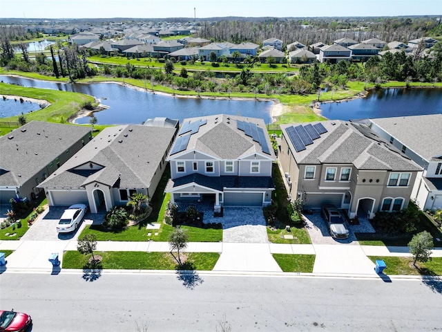 bird's eye view featuring a residential view and a water view