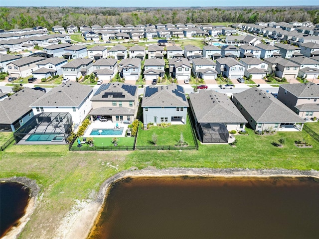 birds eye view of property featuring a residential view and a water view