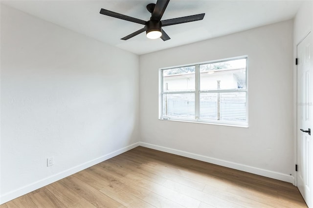 unfurnished room with light wood-style flooring, baseboards, and ceiling fan