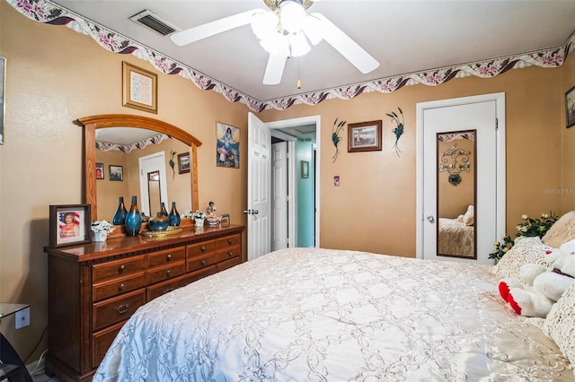 bedroom with a ceiling fan and visible vents