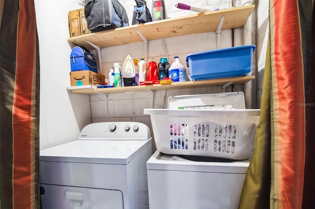 laundry area featuring laundry area and washer and clothes dryer