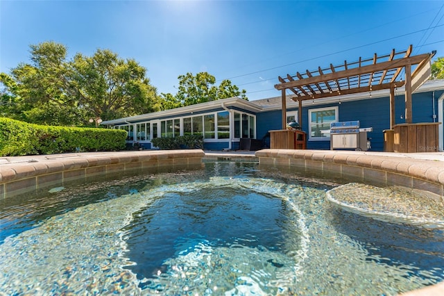 view of swimming pool with a pergola, a sunroom, and a grill