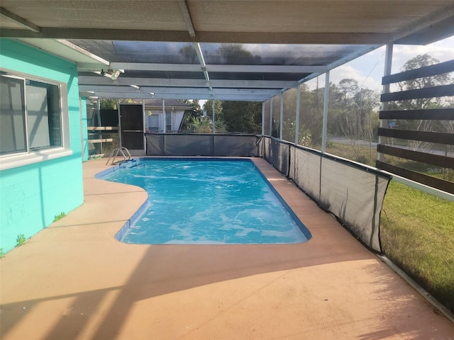 pool featuring a lanai and a patio