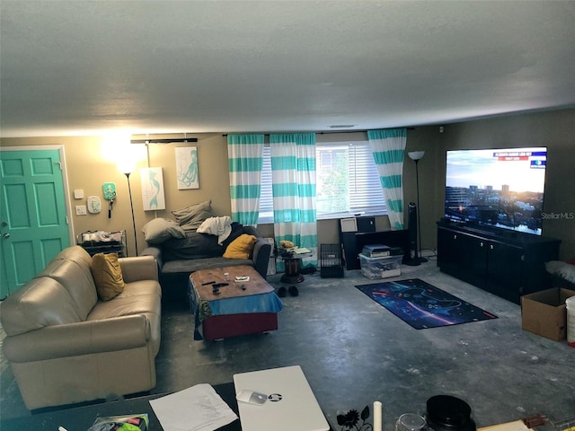 living room featuring concrete flooring