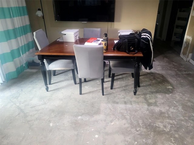 dining area with concrete floors