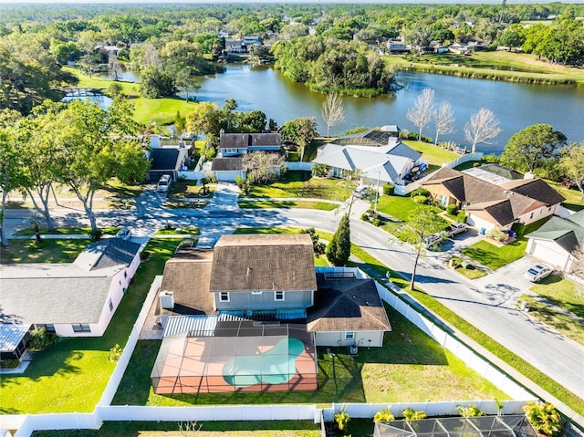 drone / aerial view featuring a residential view and a water view