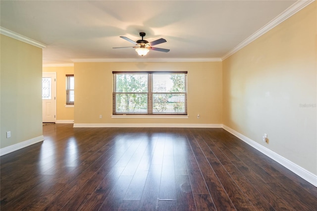 spare room with ornamental molding, baseboards, dark wood-style flooring, and ceiling fan