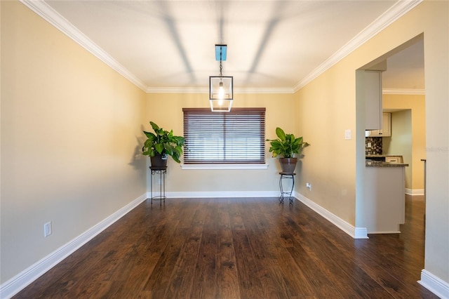 unfurnished room with crown molding, baseboards, and dark wood-style flooring