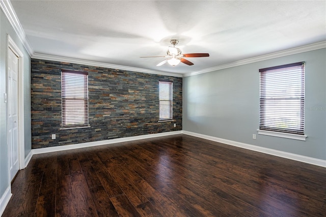 spare room with wood finished floors, plenty of natural light, ornamental molding, and a ceiling fan