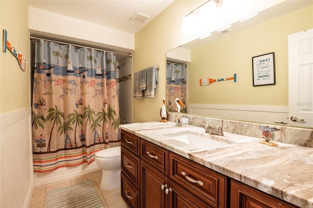 bathroom with visible vents, toilet, tile patterned flooring, shower / bath combination with curtain, and vanity