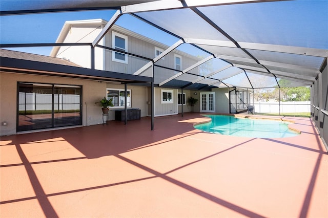 view of swimming pool featuring french doors, a patio, a fenced in pool, and a lanai