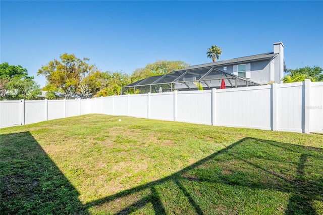 view of yard with a fenced backyard