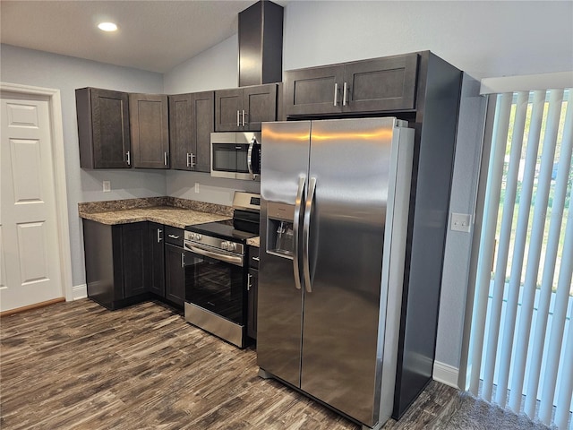 kitchen featuring dark wood-style floors, baseboards, and stainless steel appliances