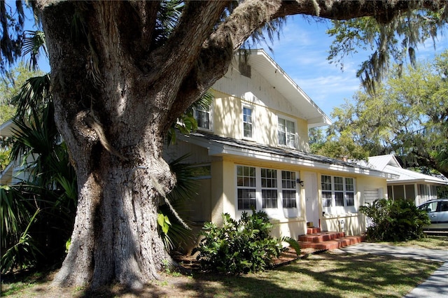 back of property featuring stucco siding