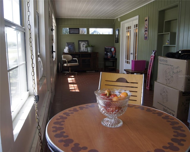 sunroom / solarium featuring plenty of natural light and wooden ceiling