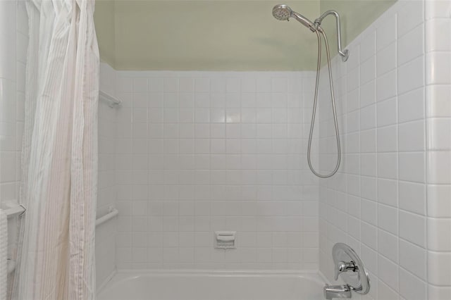 bathroom featuring shower / tub combo with curtain