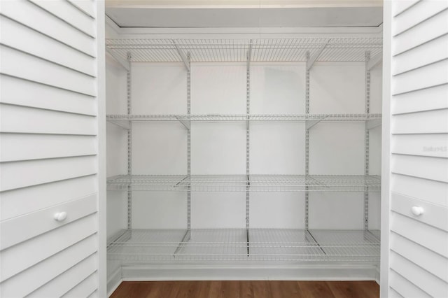 spacious closet featuring wood finished floors