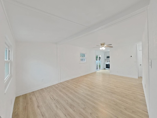 unfurnished room with light wood-style floors, ceiling fan, baseboards, and beamed ceiling