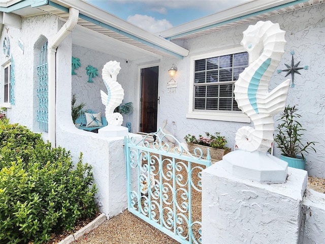 property entrance with stucco siding