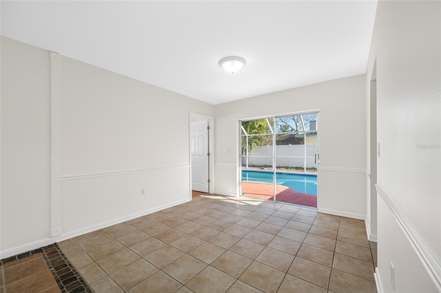 empty room featuring baseboards