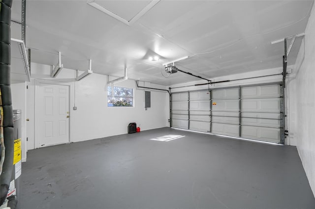 garage with electric panel and a garage door opener