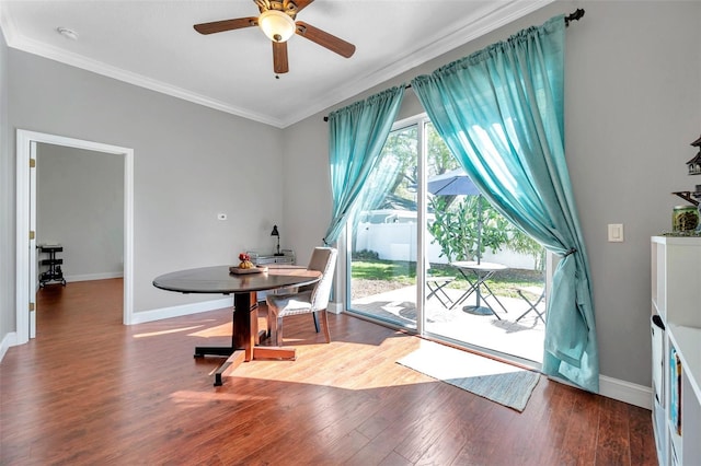 dining space featuring ceiling fan, ornamental molding, wood finished floors, and baseboards