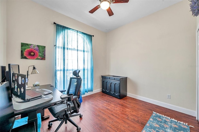 office area featuring ceiling fan, baseboards, and wood finished floors