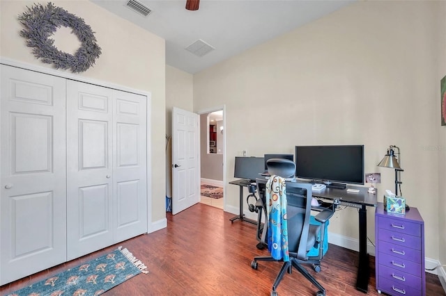 office space featuring ceiling fan, wood finished floors, visible vents, and baseboards