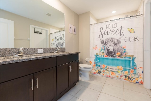 full bathroom featuring tile patterned flooring, visible vents, a sink, and double vanity