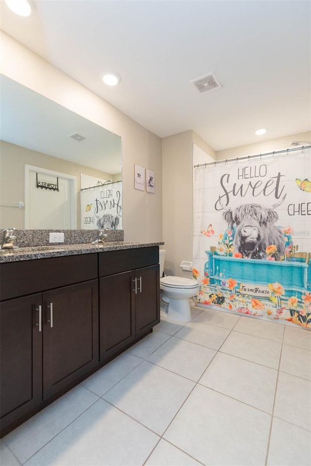 full bath featuring tile patterned flooring, visible vents, vanity, and toilet