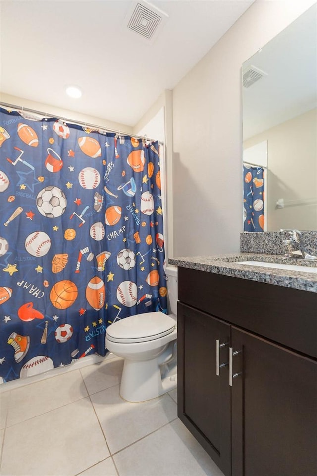 full bath with toilet, vanity, visible vents, and tile patterned floors